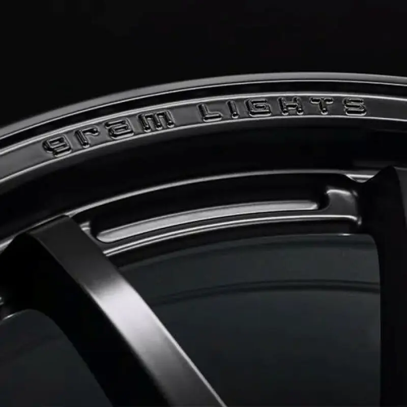 Gram Lights 57NR LIMITED II 18x9.5 +12 5-114.3 Semigloss Black Wheel w/ Black Cap/Stickers/Air Valve